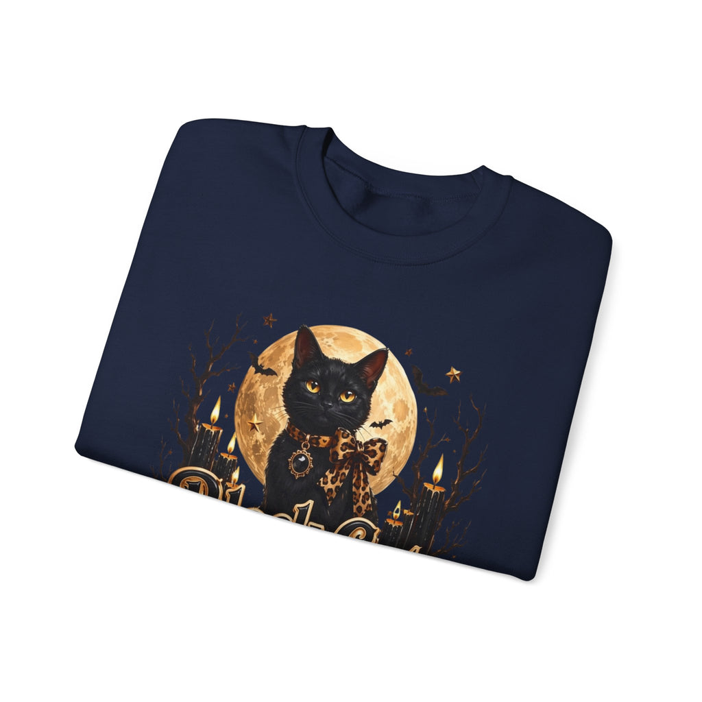 Navy crewneck sweatshirt folded to show the black cat sits before a glowing full moon print
