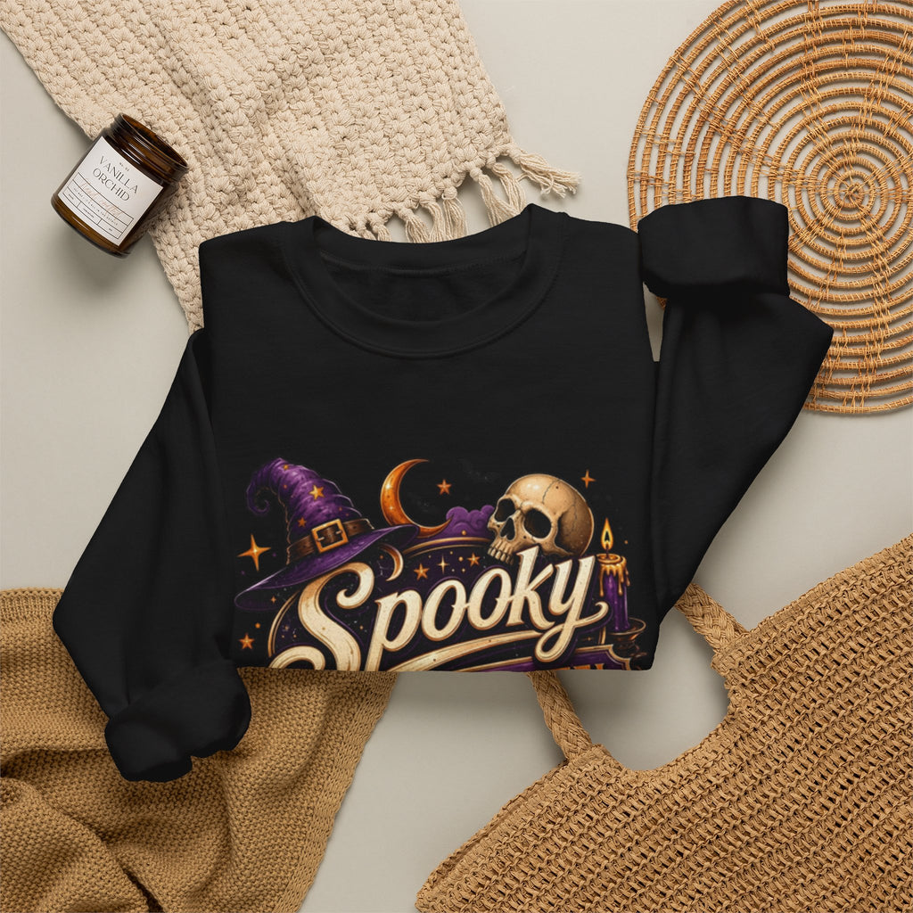 Black crewneck sweatshirt styled flat with a candle — neon Spooky Witch Motel sign