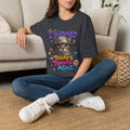 Dark Heather Grey t-shirt laid flat, printed with a flat-eyed cat wearing a battered steel helmet