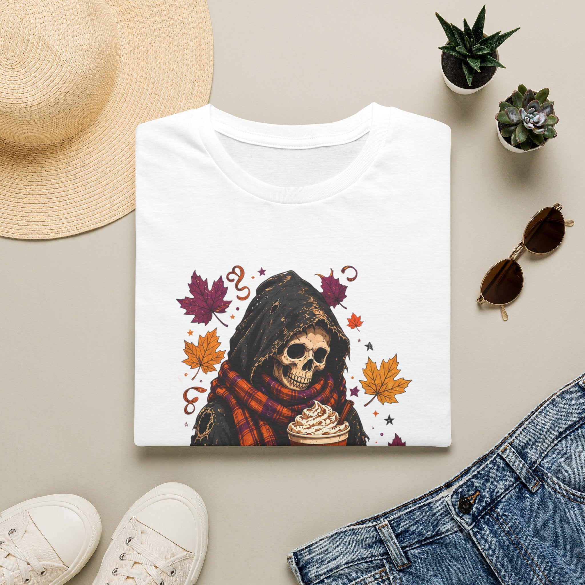 White t-shirt styled flat with a candle — hooded reaper with pumpkin spice drink
