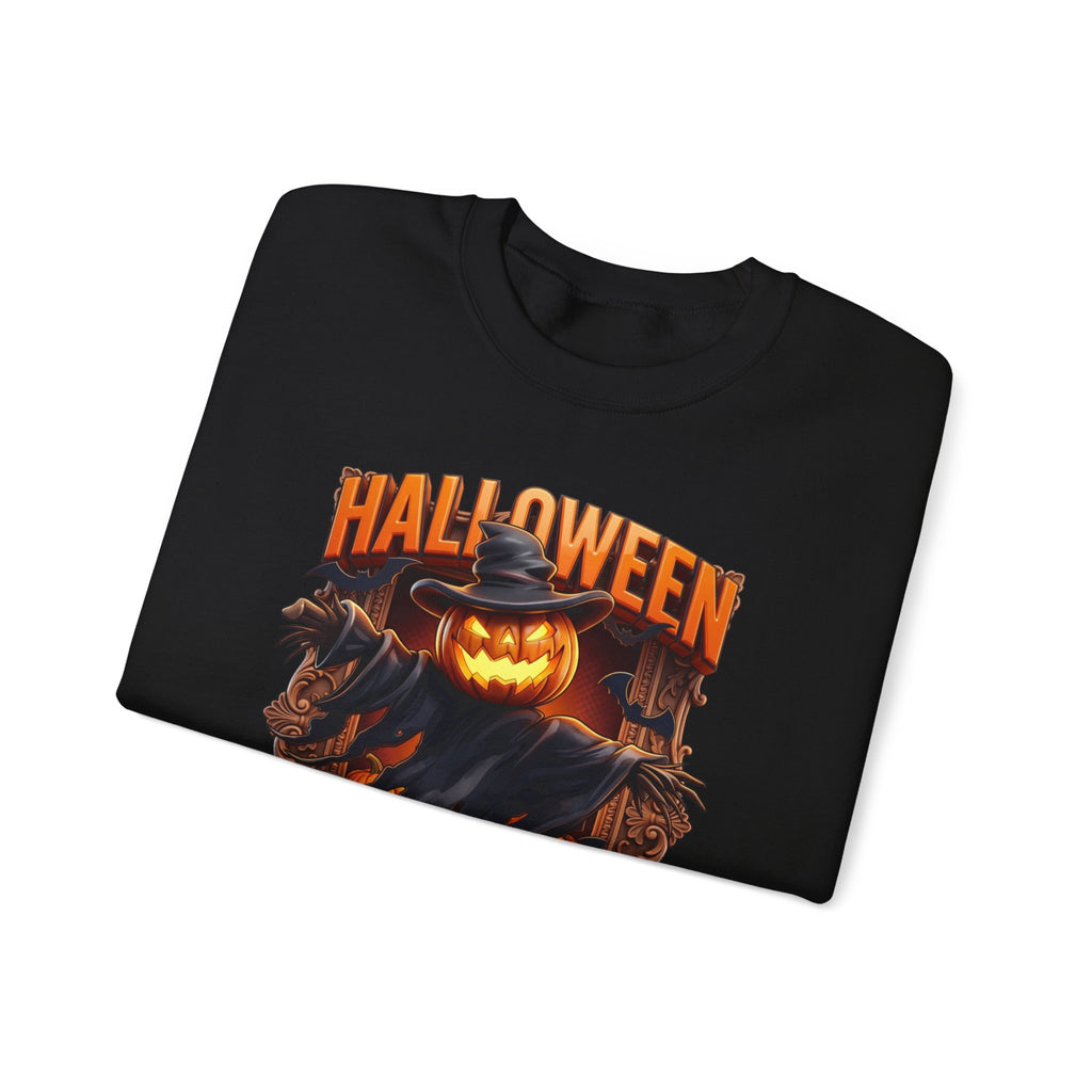 Black crewneck sweatshirt folded to show the scarecrow with a glowing jack-o-lantern head stands print