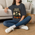 Dark Heather Grey t-shirt laid flat, printed with a two ghosts around a campfire inside a rounded vintage