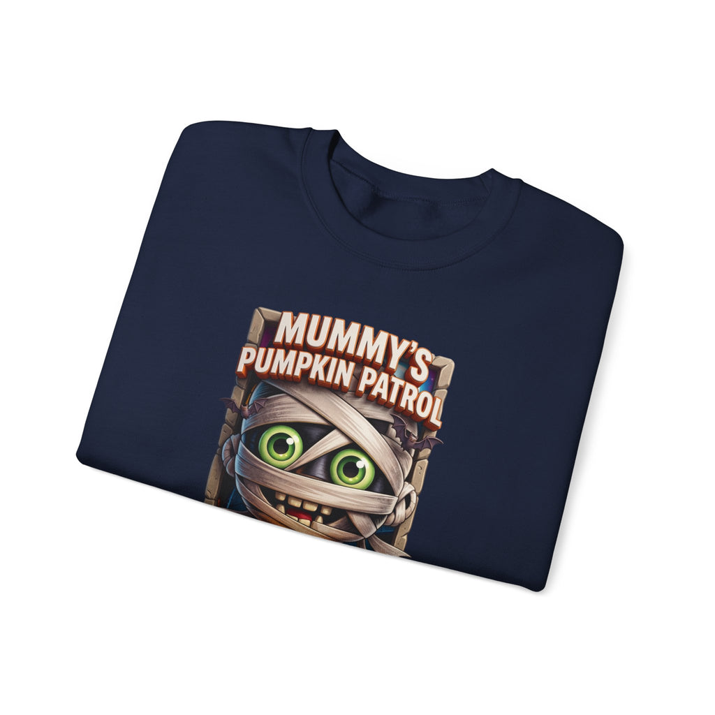 Navy crewneck sweatshirt folded to show the wide-eyed cartoon mummy wrapped in bandages hugs a carved print