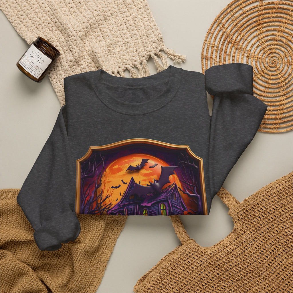 Dark Heather crewneck sweatshirt styled flat with a candle — haunted mansion under an orange moon