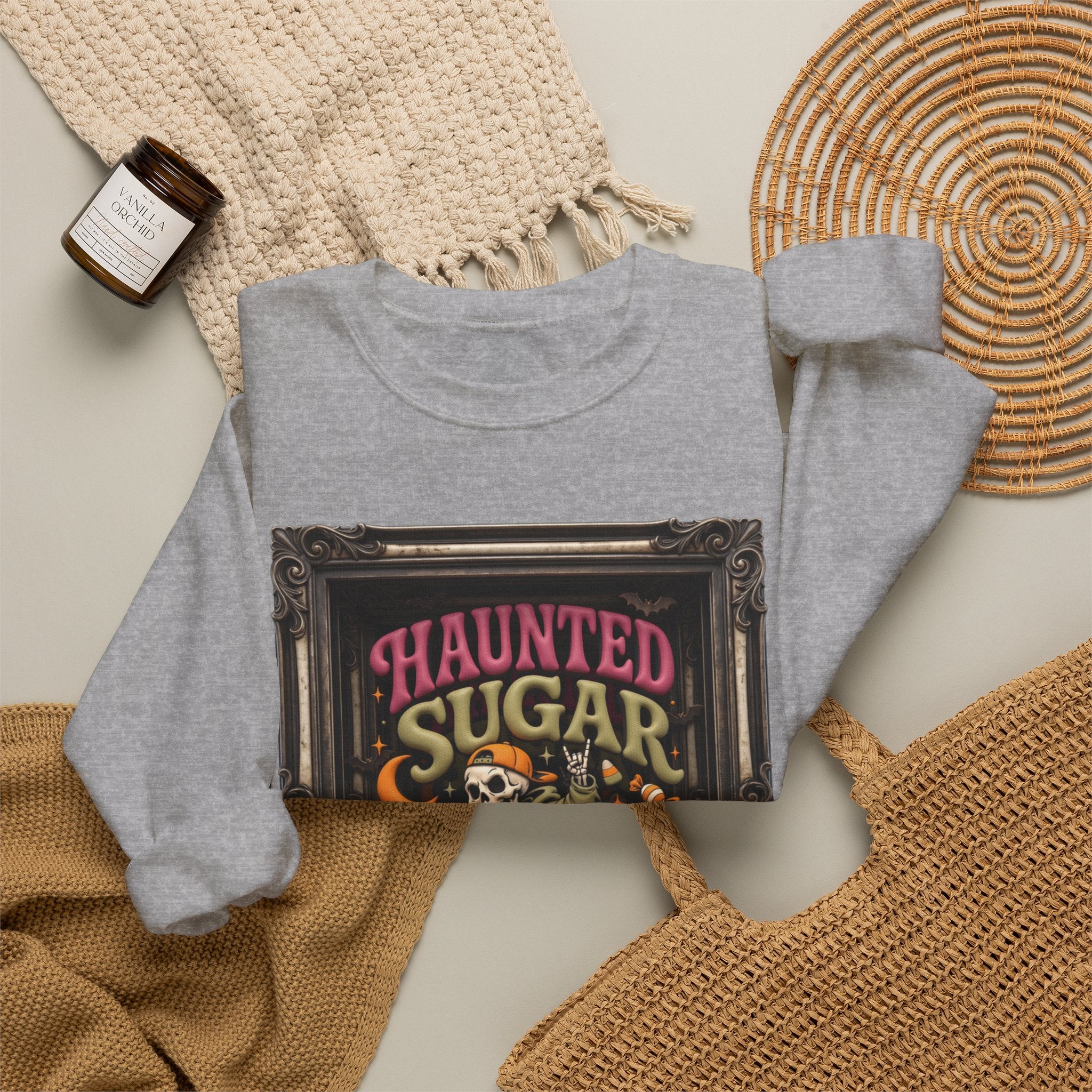 Sport Grey crewneck sweatshirt styled flat with a candle — hooded skeleton riding a broom