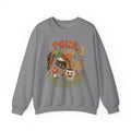 Graphite Heather crewneck sweatshirt laid flat, printed with a green witch hand tipping a flower-patterned coffee pot into