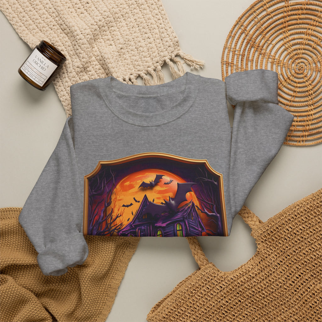 Graphite Heather crewneck sweatshirt styled flat with a candle — haunted mansion under an orange moon