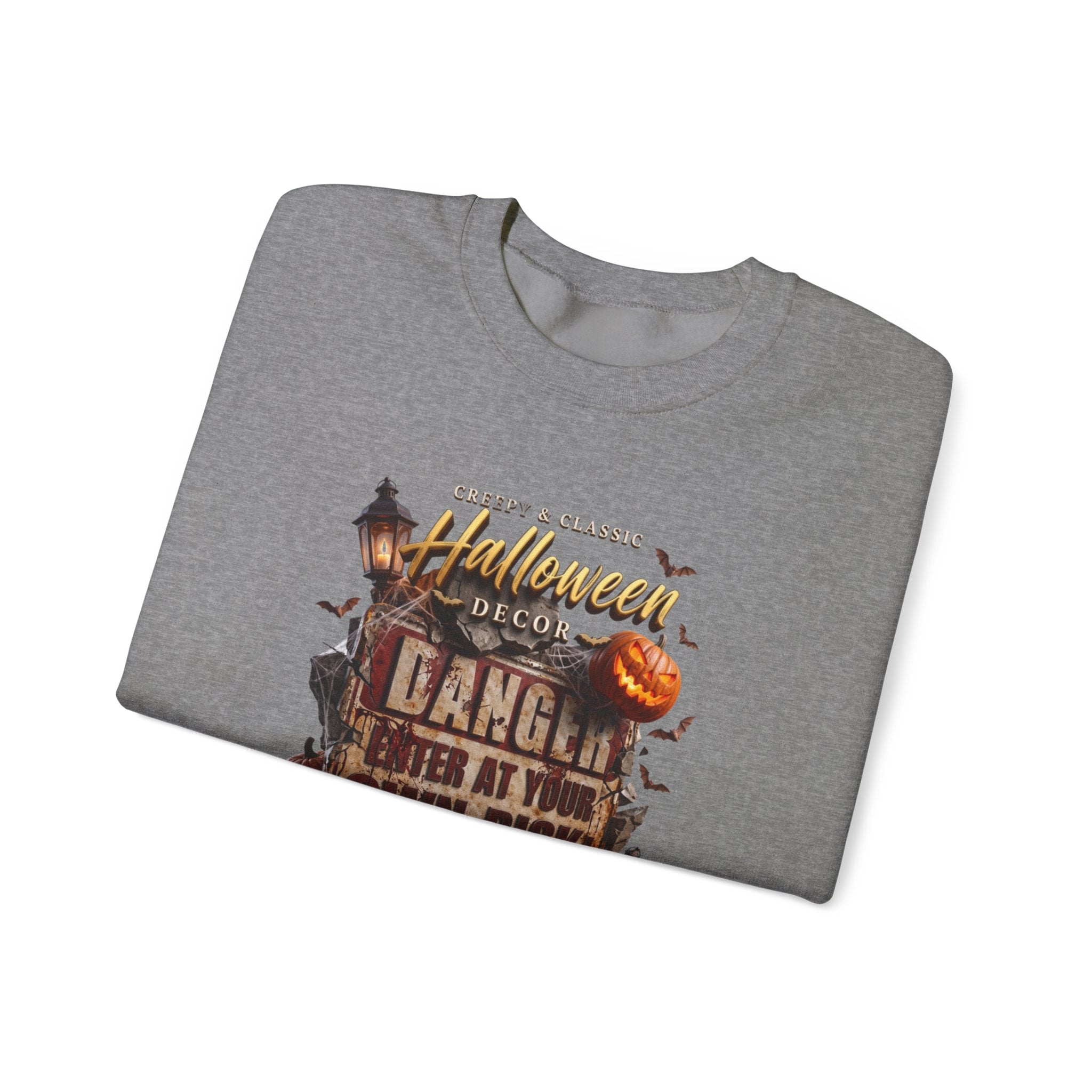 Graphite Heather crewneck sweatshirt folded to show the aged danger sign hangs above a cluster of glowing print