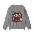 Graphite Heather crewneck sweatshirt laid flat, printed with a neon vintage motel sign reading spooky witch motel