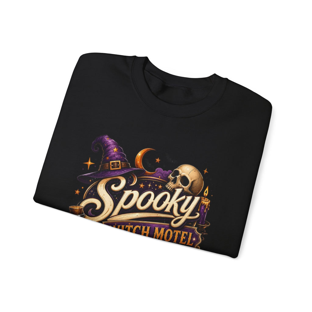 Black crewneck sweatshirt folded to show the neon vintage motel sign reading spooky witch motel print