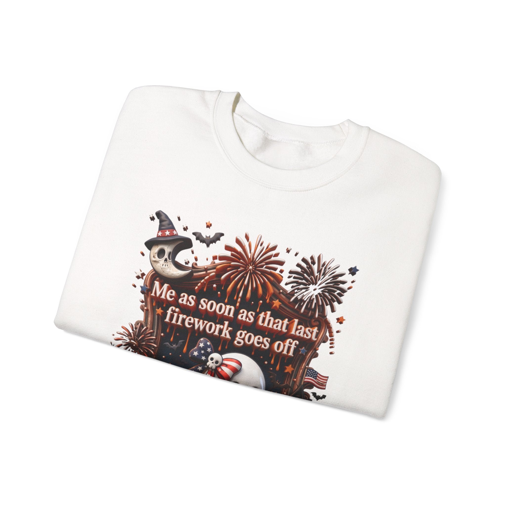 White crewneck sweatshirt folded to show the wide-eyed ghost clutches a striped firework print