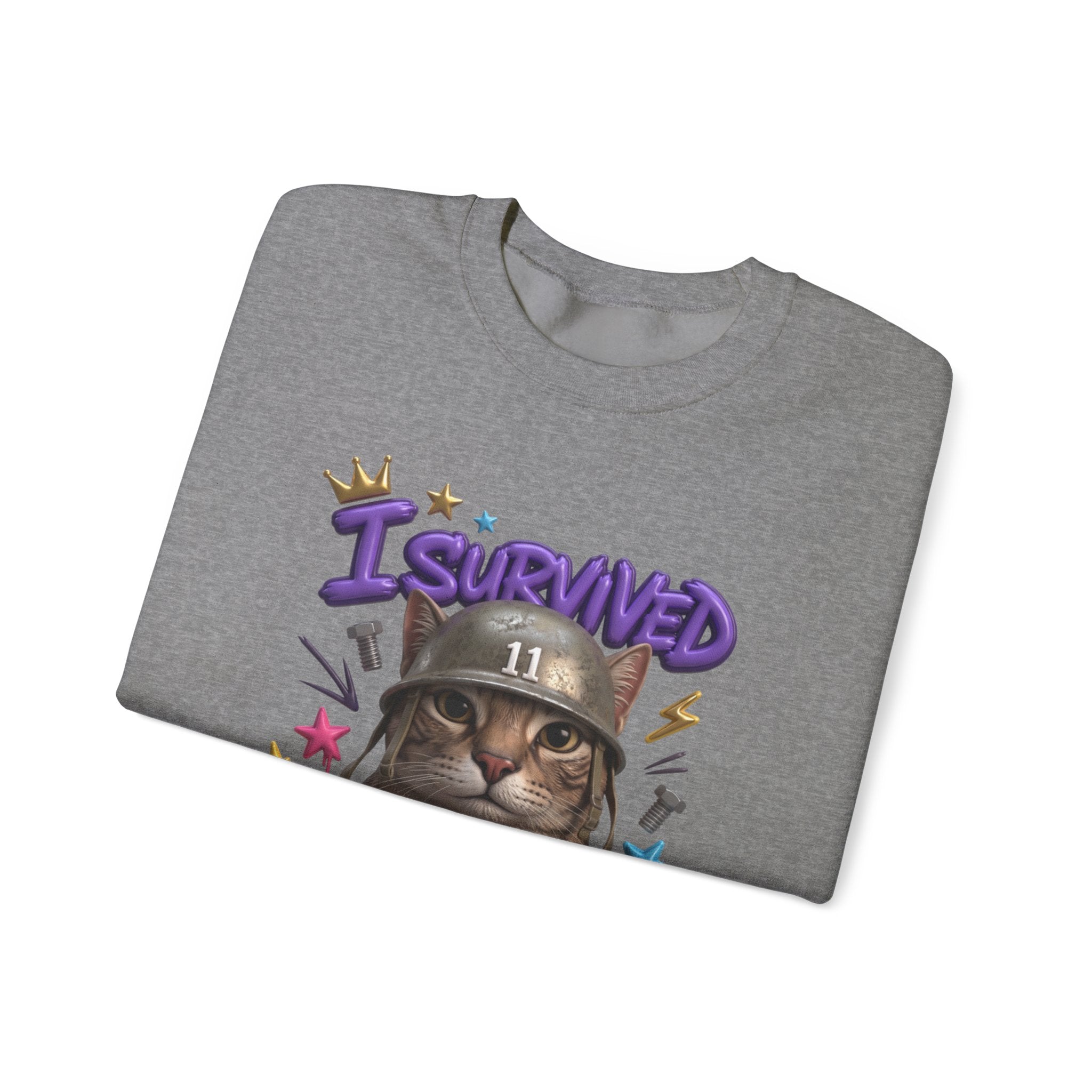 Graphite Heather crewneck sweatshirt folded to show the flat-eyed cat wearing a battered steel helmet print