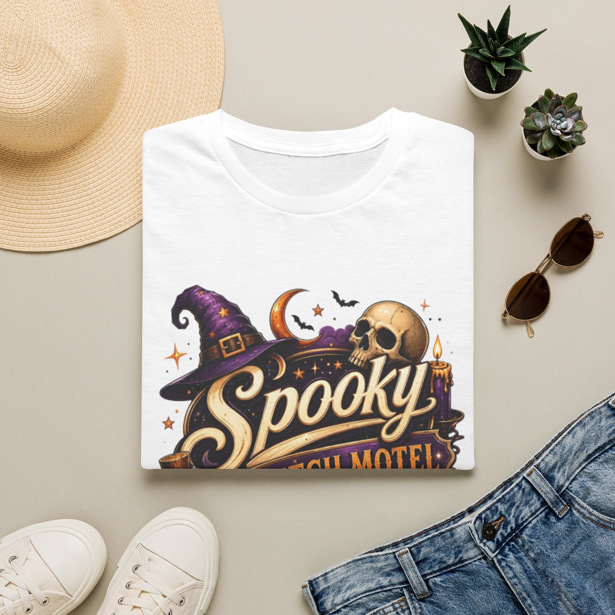White t-shirt styled flat with a candle — neon Spooky Witch Motel sign