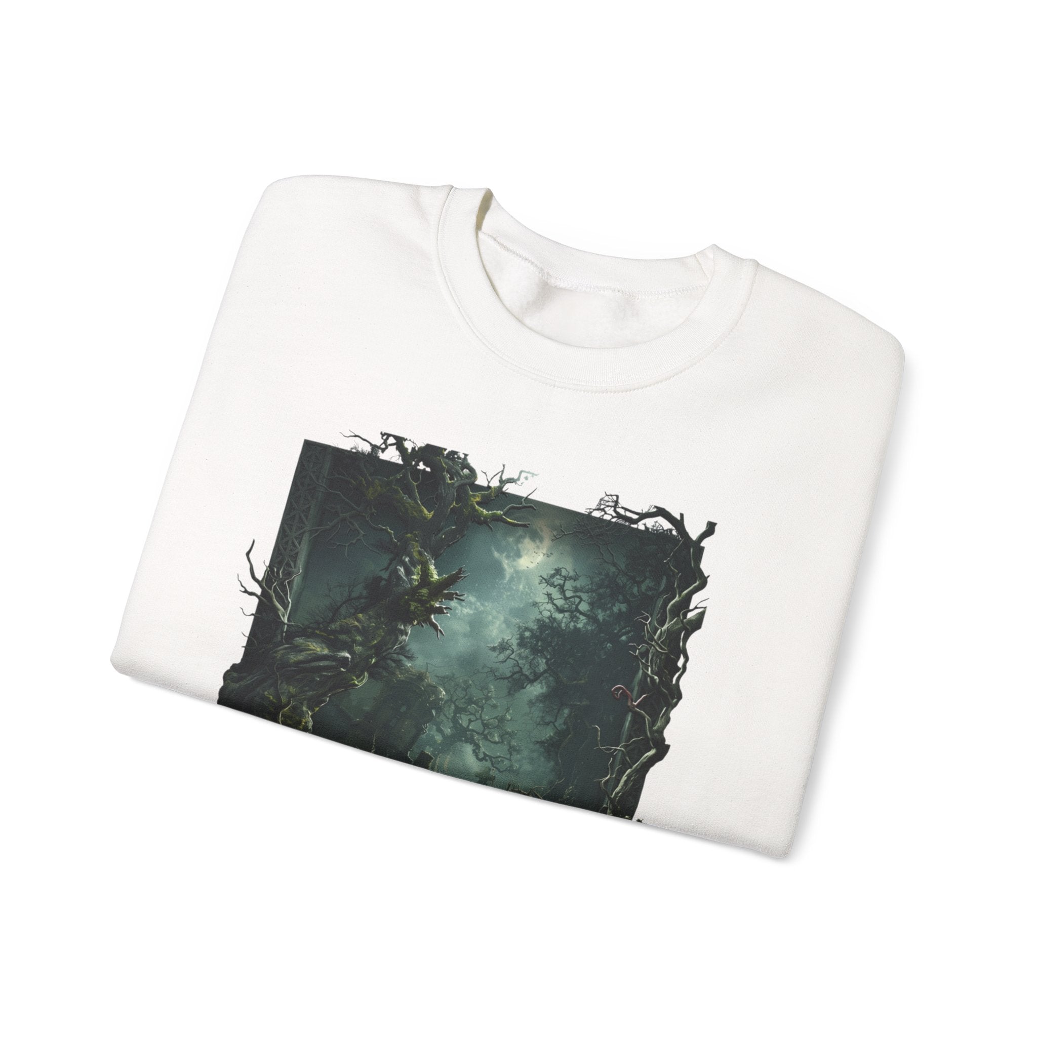 White crewneck sweatshirt folded to show the moonlit forest of gnarled mossy trees drifts into pale print