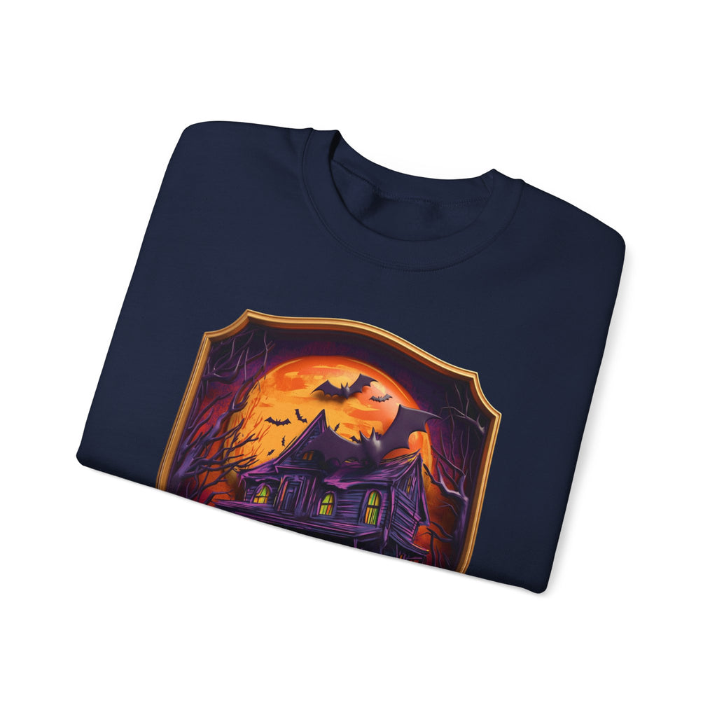 Navy crewneck sweatshirt folded to show the purple haunted mansion sits under a blazing orange moon print