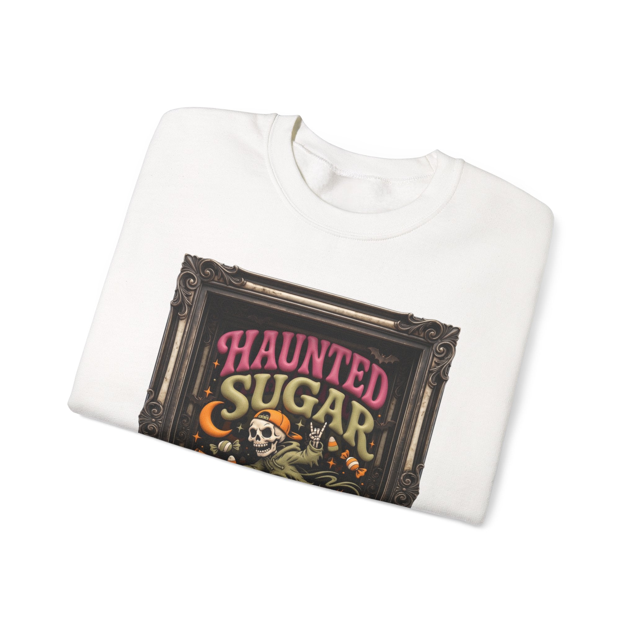 White crewneck sweatshirt folded to show the hooded skeleton rides a broom past a crescent moon print