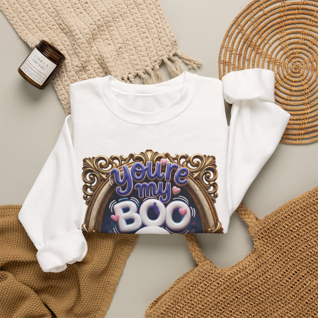White crewneck sweatshirt styled flat with a candle — smiling ghost in a gilded frame