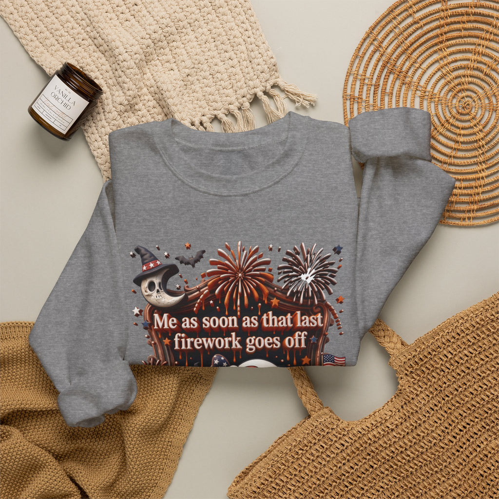 Graphite Heather crewneck sweatshirt styled flat with a candle — wide-eyed ghost clutching a firework