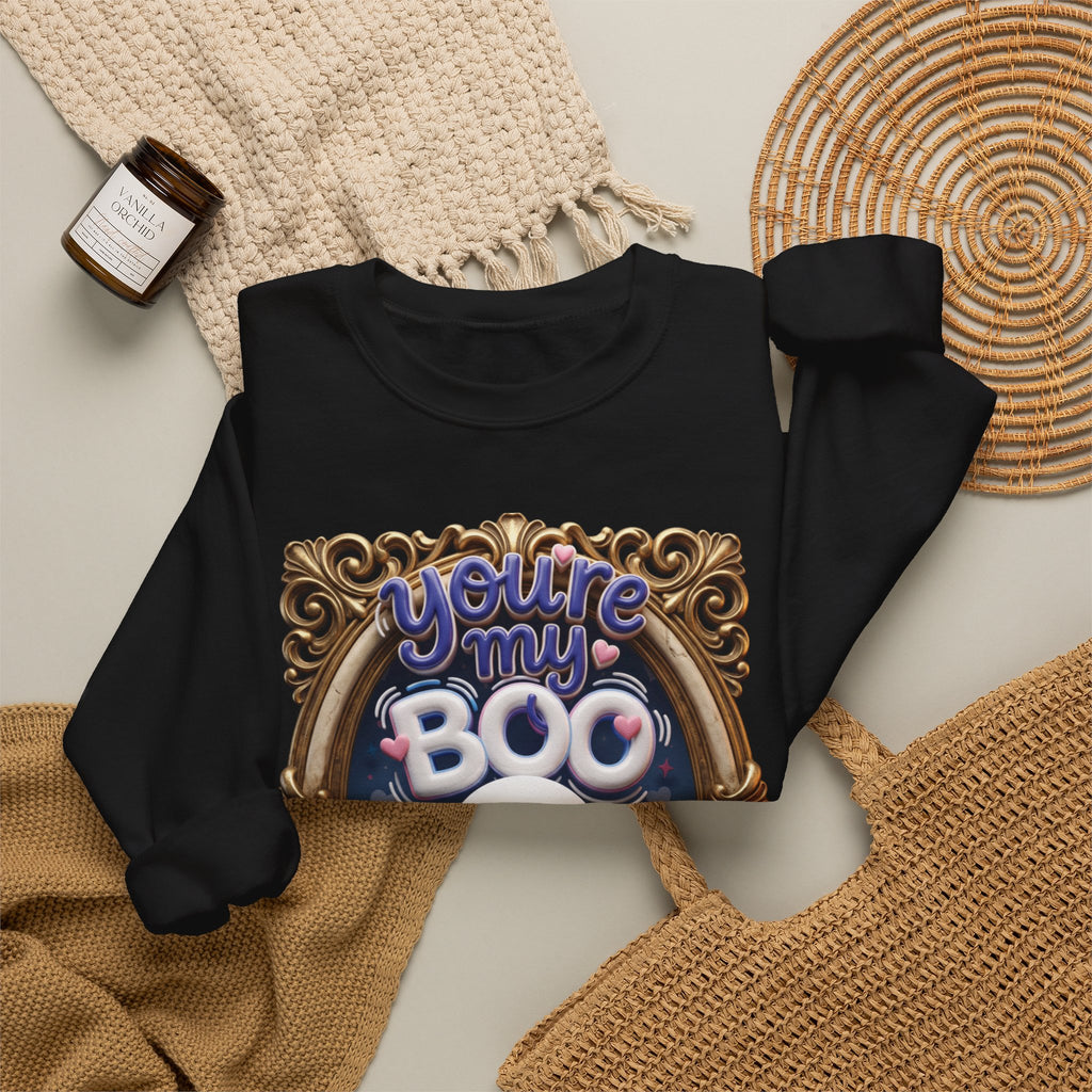Black crewneck sweatshirt styled flat with a candle — smiling ghost in a gilded frame