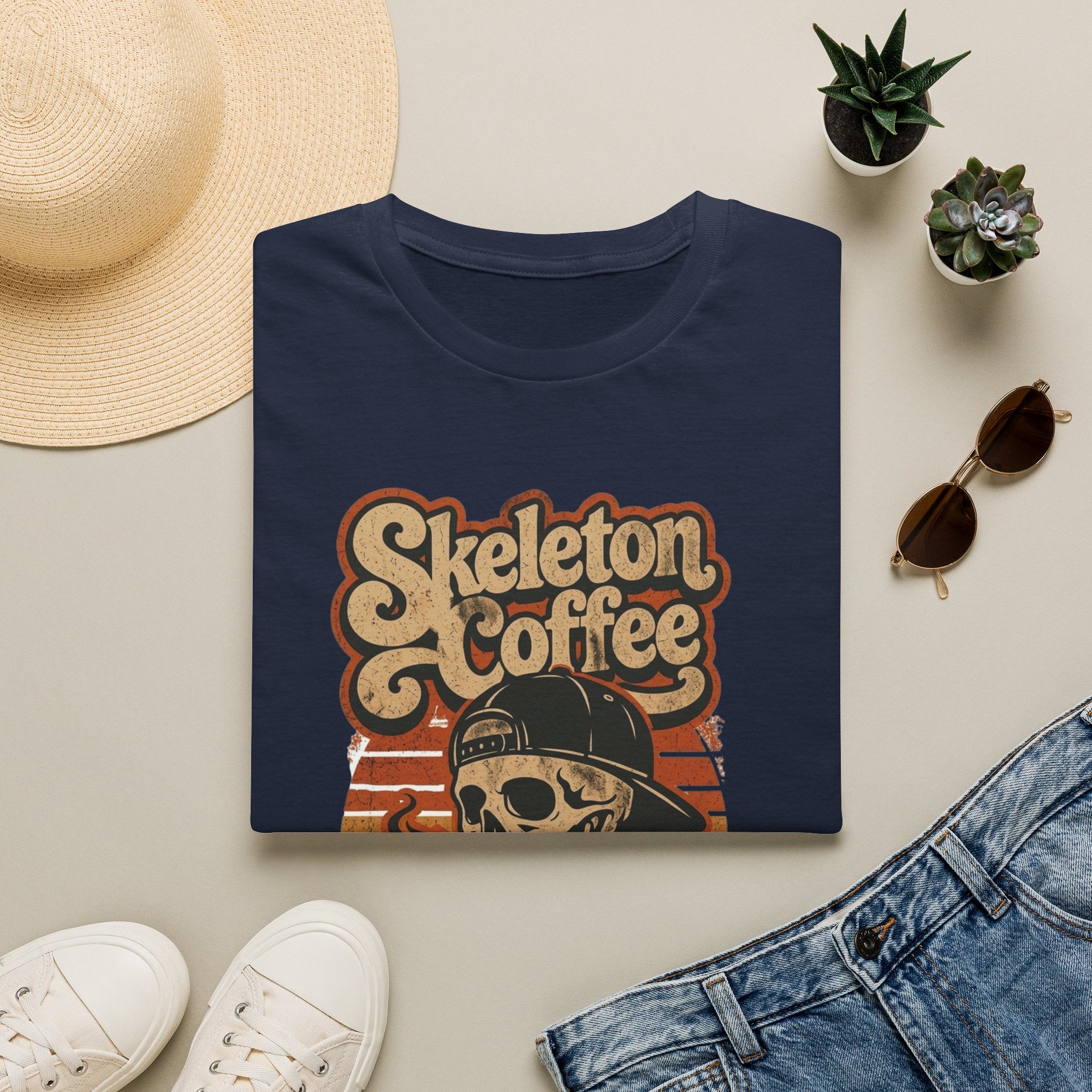 Navy t-shirt styled flat with a candle — skeleton in a sweater holding coffee