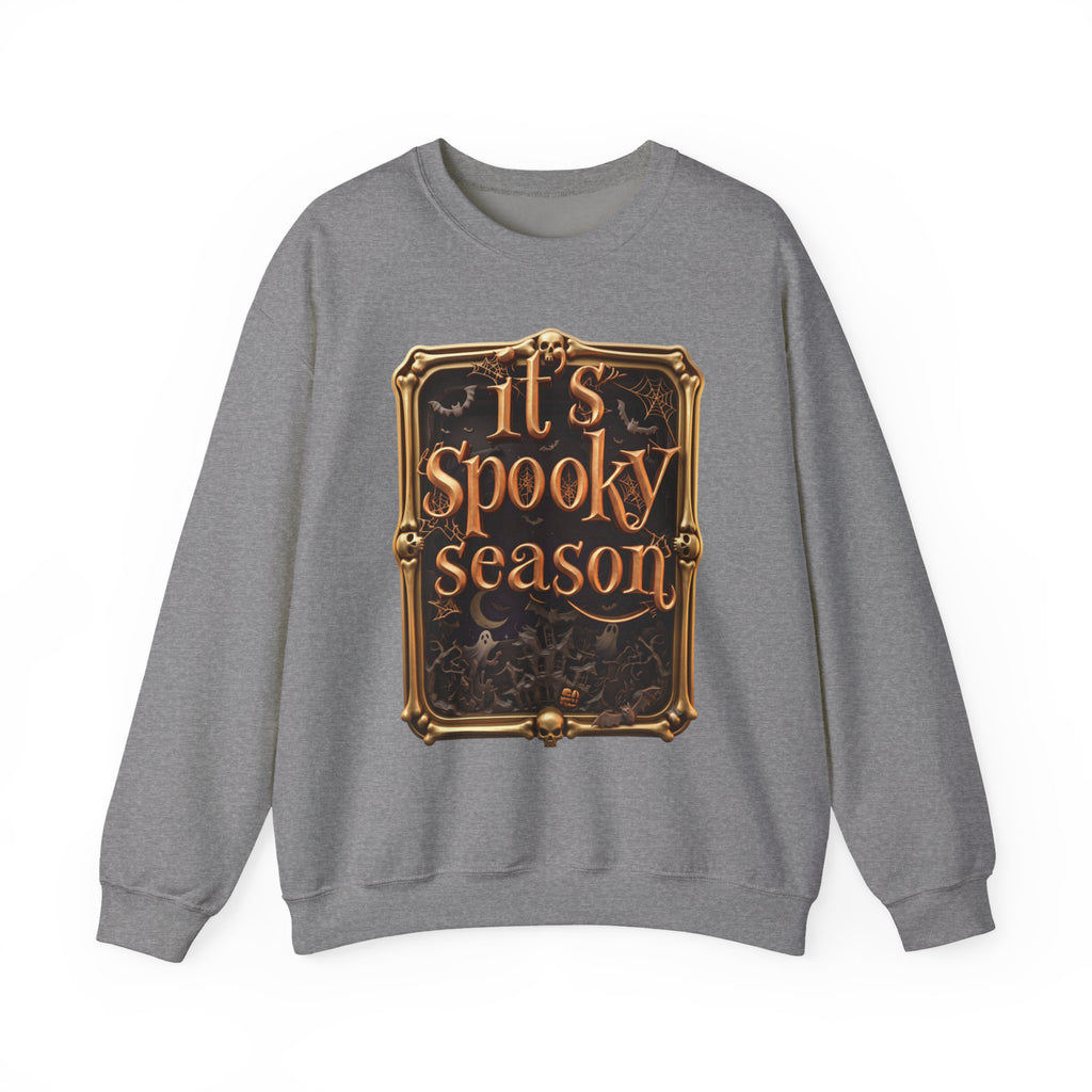 Graphite Heather crewneck sweatshirt laid flat, printed with a copper serif lettering reads it's spooky season inside