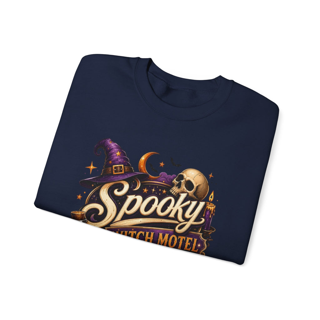Navy crewneck sweatshirt folded to show the neon vintage motel sign reading spooky witch motel print