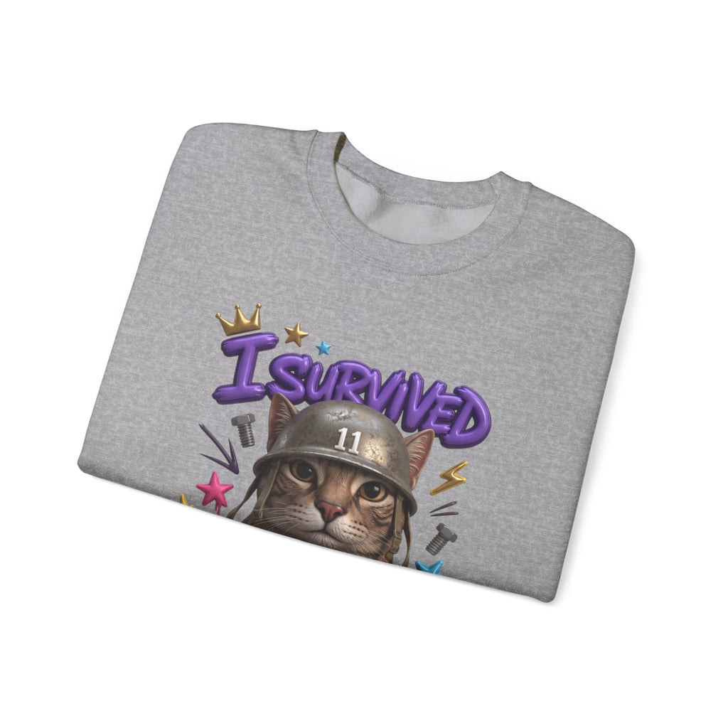 Sport Grey crewneck sweatshirt folded to show the flat-eyed cat wearing a battered steel helmet print