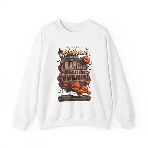 White crewneck sweatshirt laid flat, printed with a aged danger sign hangs above a cluster of glowing