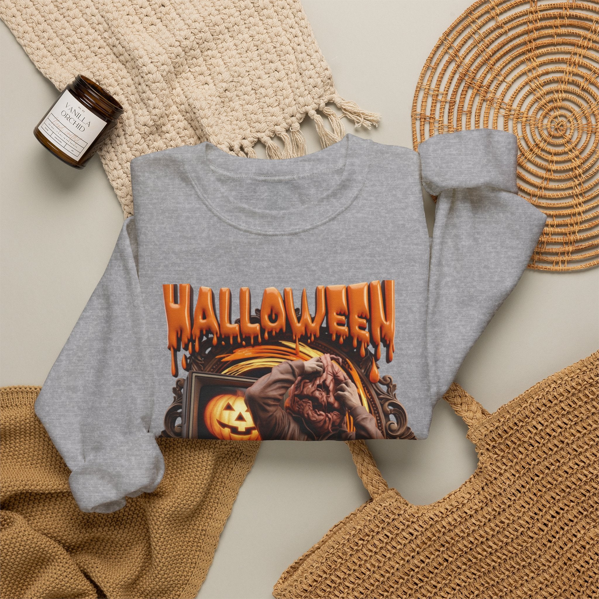 Sport Grey crewneck sweatshirt styled flat with a candle — hunched monster clawing its own head