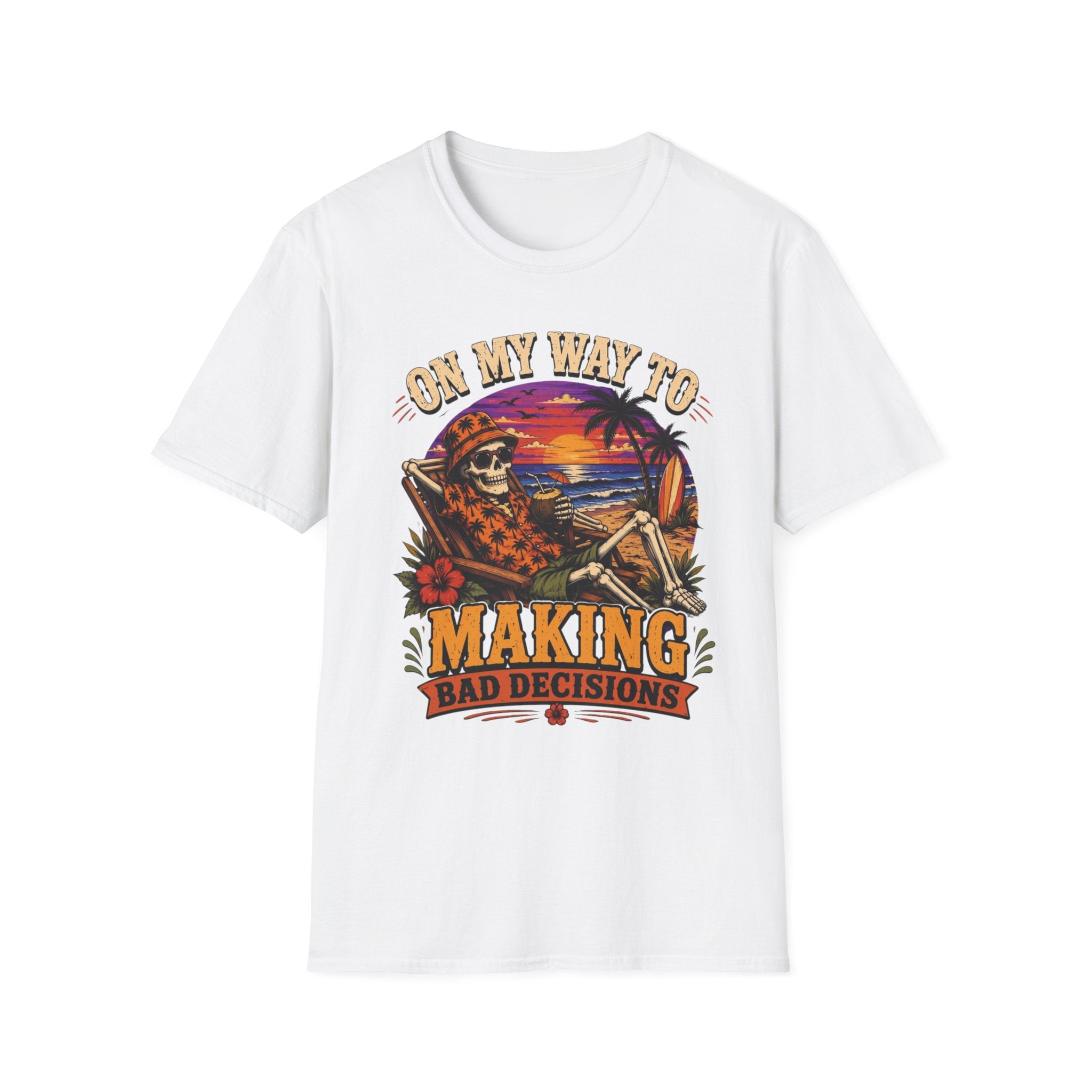White t-shirt laid flat, printed with a skeleton lounging on a beach beneath a tropical sunset