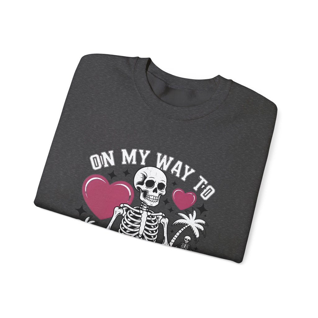 Dark Heather crewneck sweatshirt folded to show the two line drawn skeletons under pink hearts print