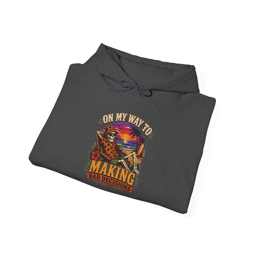 Dark Heather hoodie styled flat with a candle — sunset skeleton print