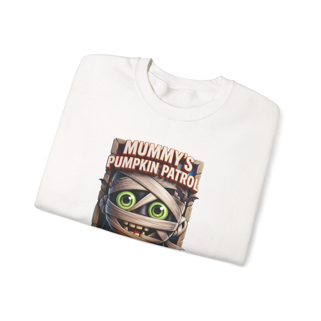 White crewneck sweatshirt folded to show the wide-eyed cartoon mummy wrapped in bandages hugs a carved print