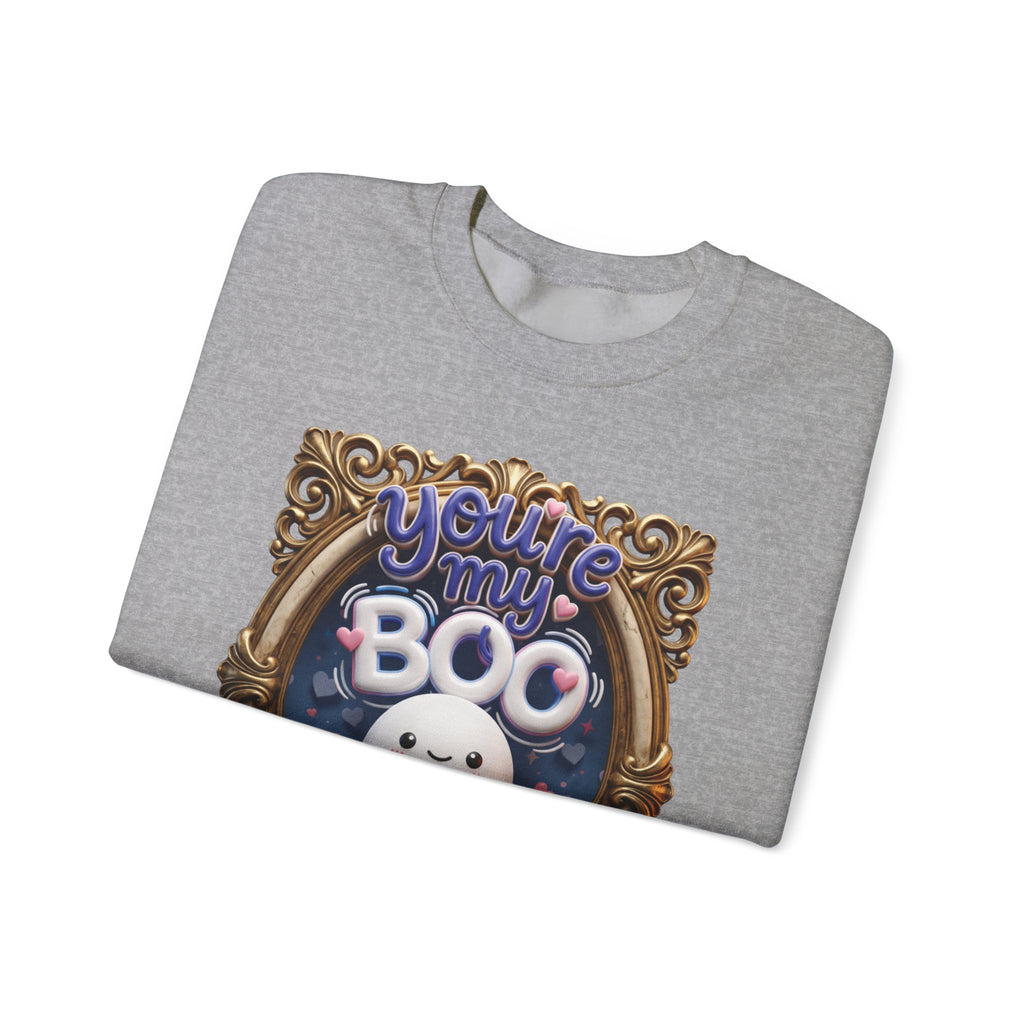 Sport Grey crewneck sweatshirt folded to show the round smiling ghost floats inside a gilded vintage frame print