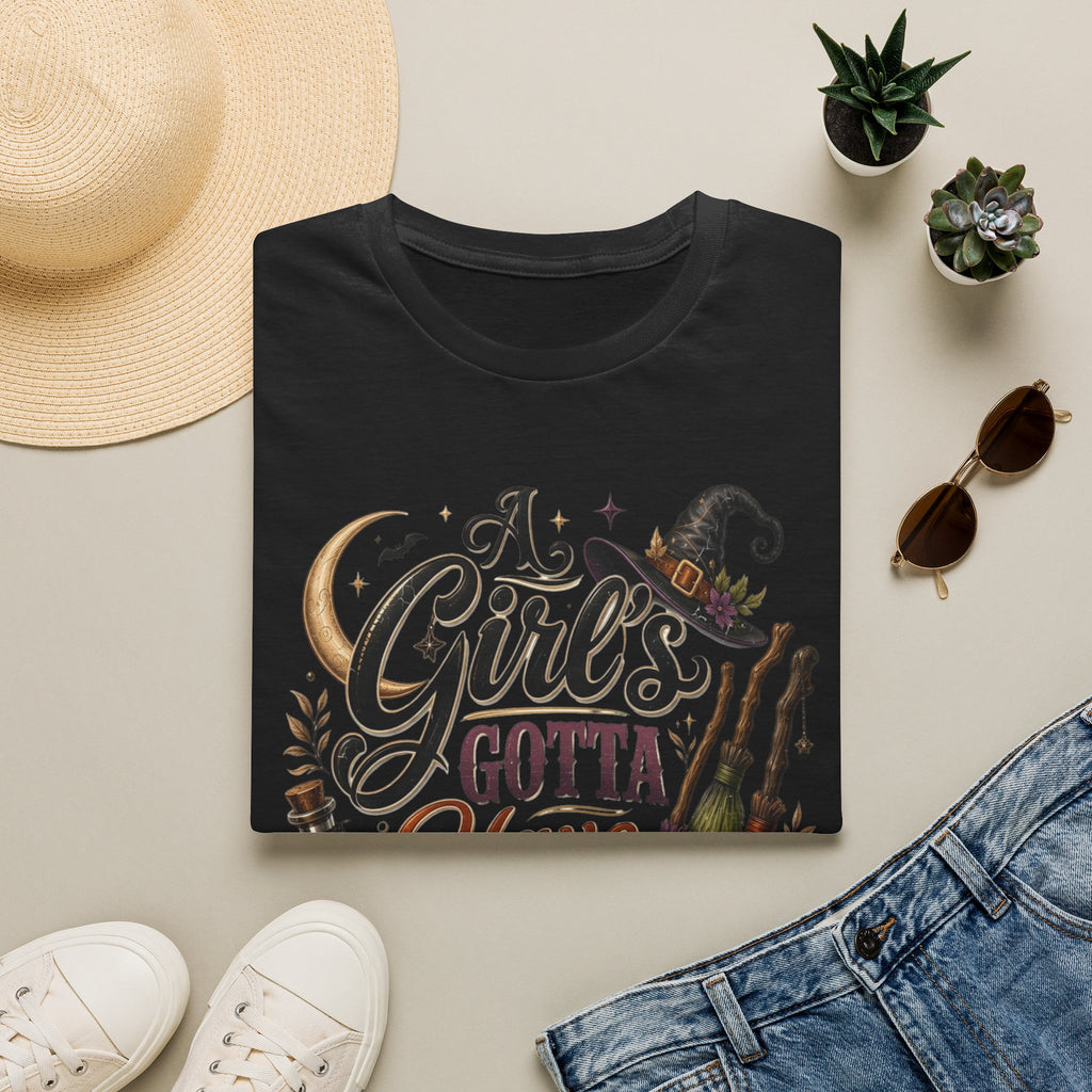Black t-shirt styled flat with a candle — hand-lettered A Girl's Gotta Have Options