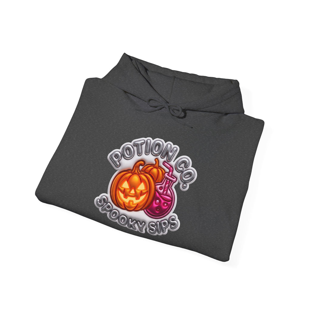 Dark Heather hoodie styled flat with a candle — Potion Co jack-o-lanterns and potion bottles