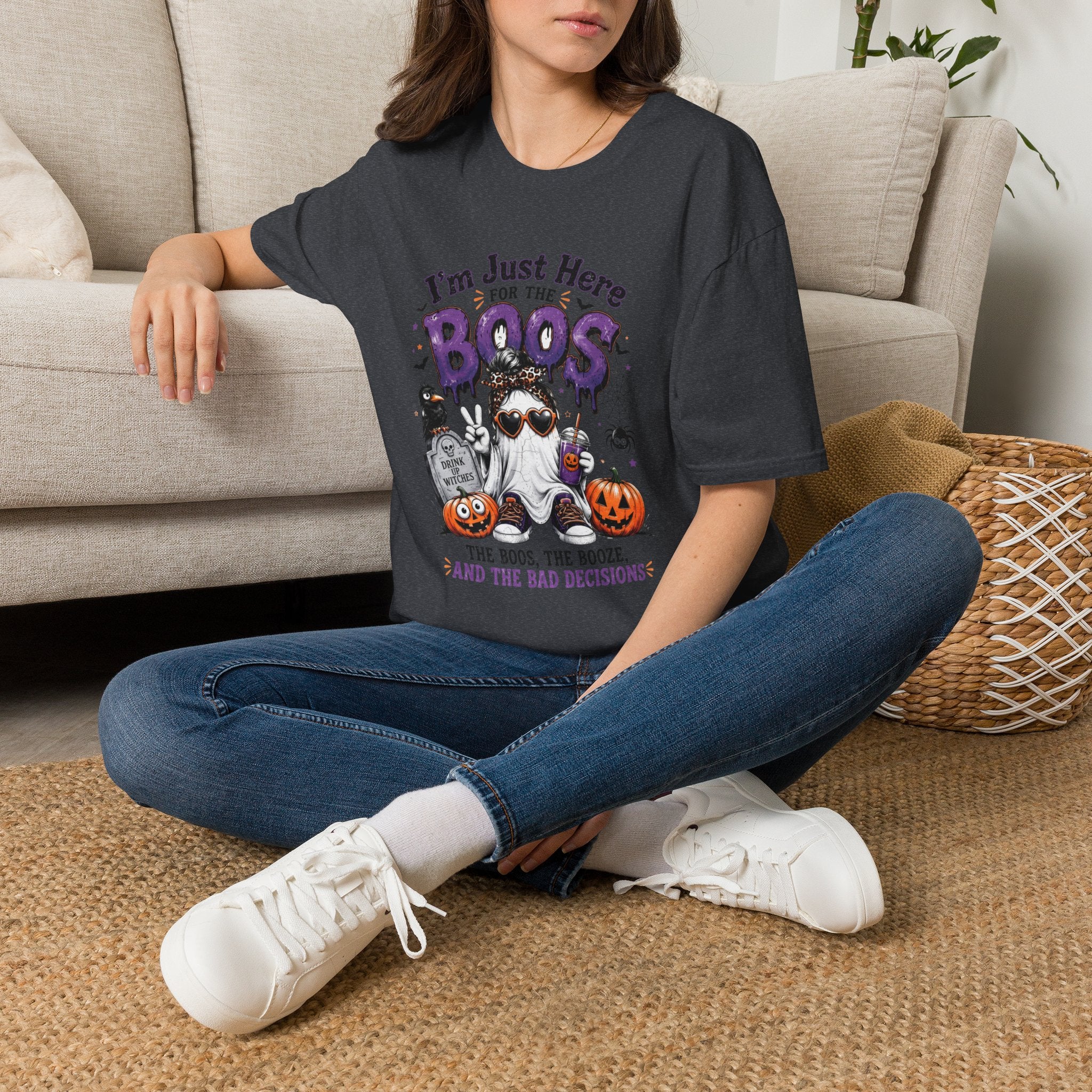 Dark Heather Grey t-shirt laid flat, printed with a cartoon ghosts in sunglasses stacked over pumpkins
