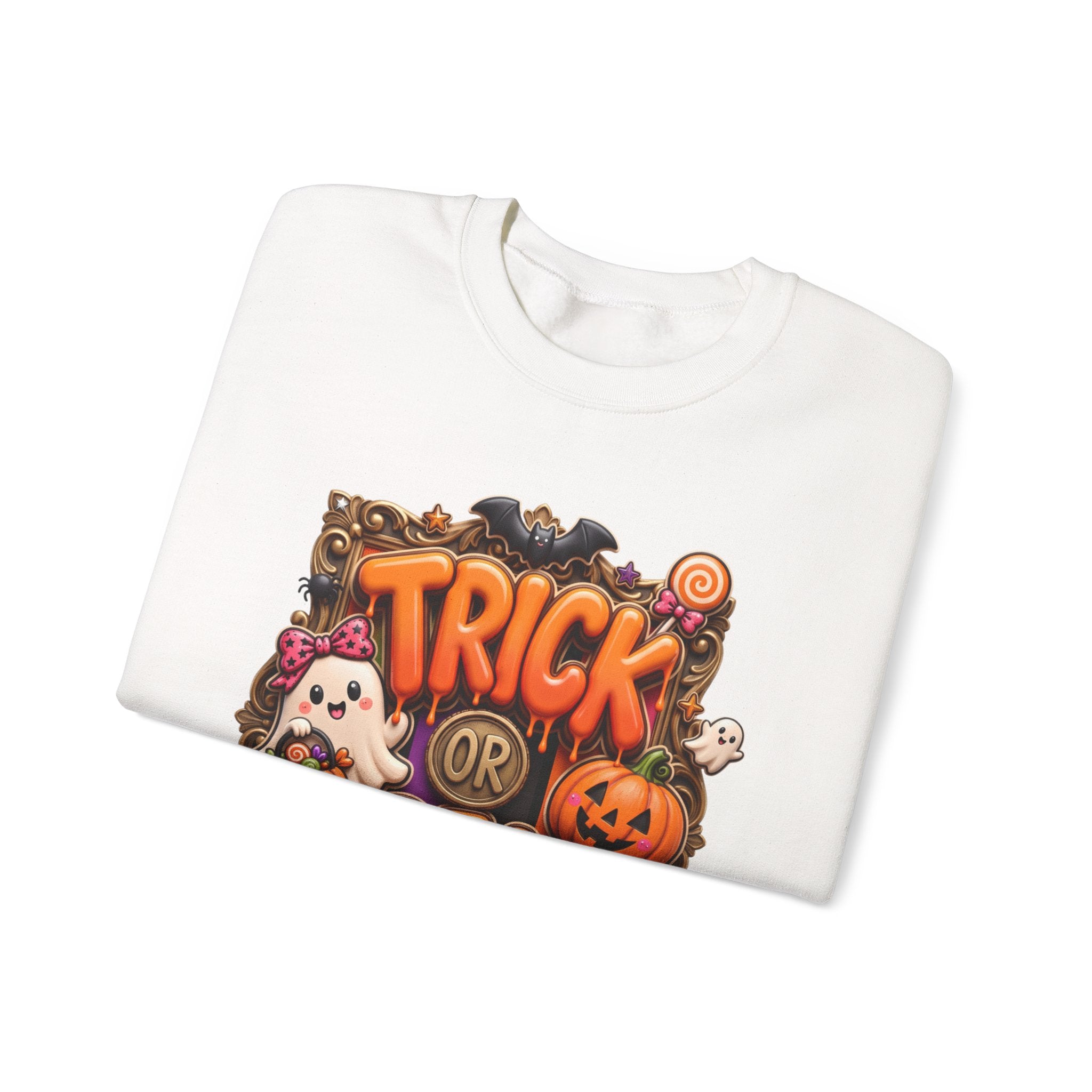 White crewneck sweatshirt folded to show the puffy orange trick or treat lettering frames a bow-wearing print