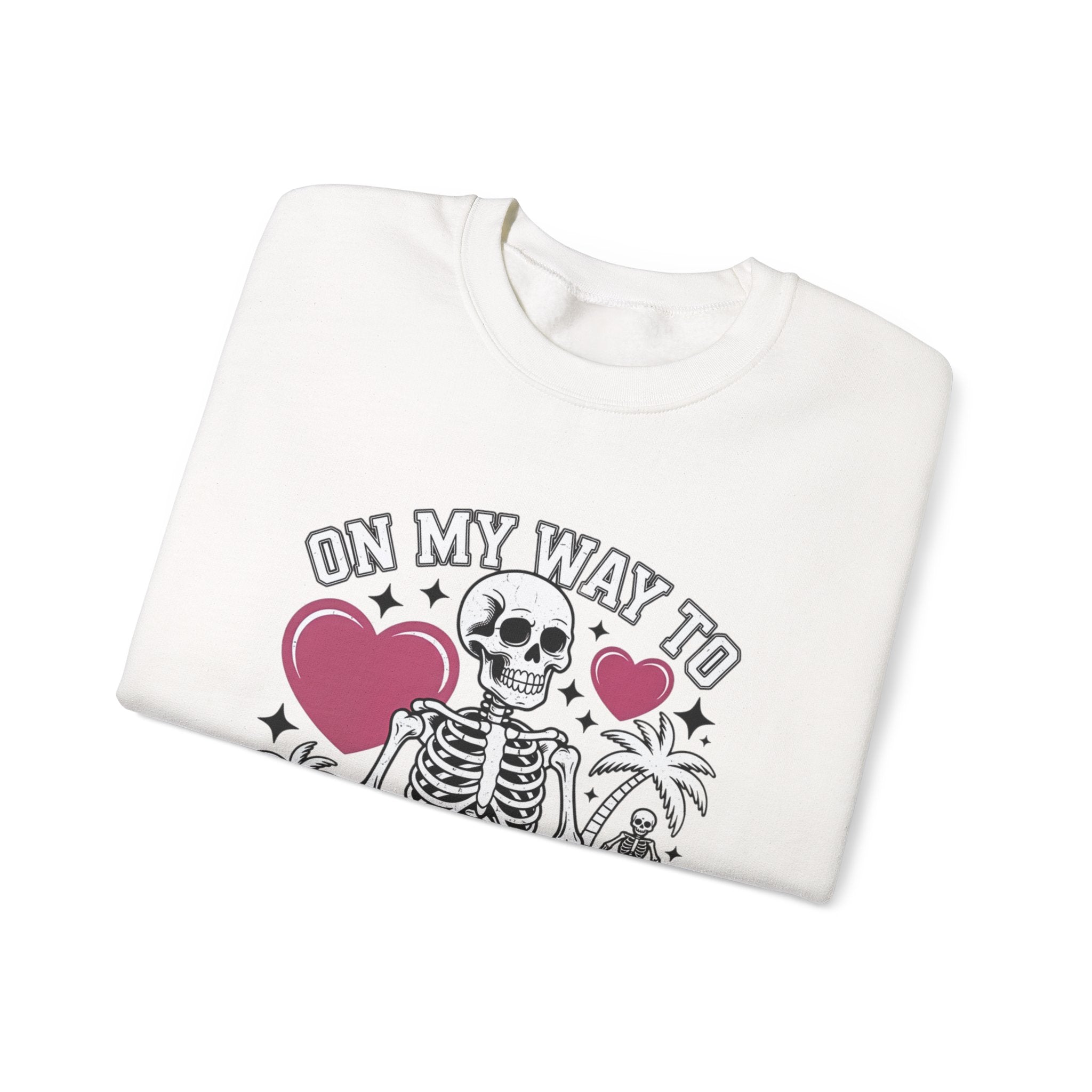 White crewneck sweatshirt folded to show the two line drawn skeletons under pink hearts print