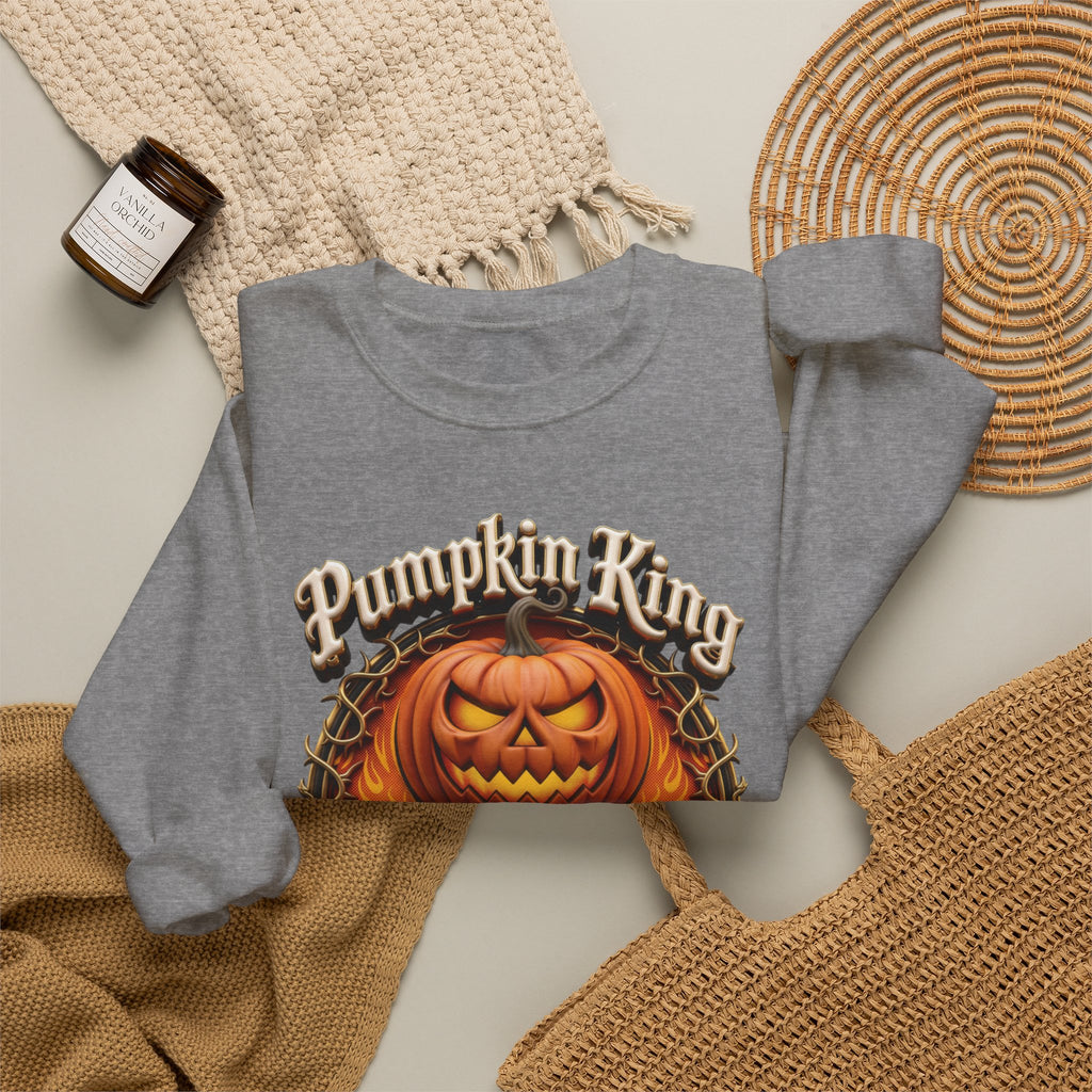 Graphite Heather crewneck sweatshirt styled flat with a candle — two jack-o-lanterns in a thorny wreath