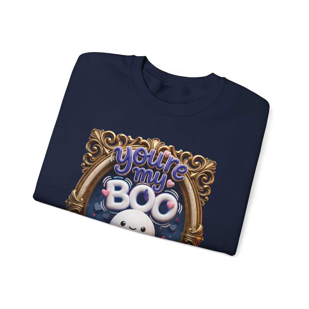 Navy crewneck sweatshirt folded to show the round smiling ghost floats inside a gilded vintage frame print