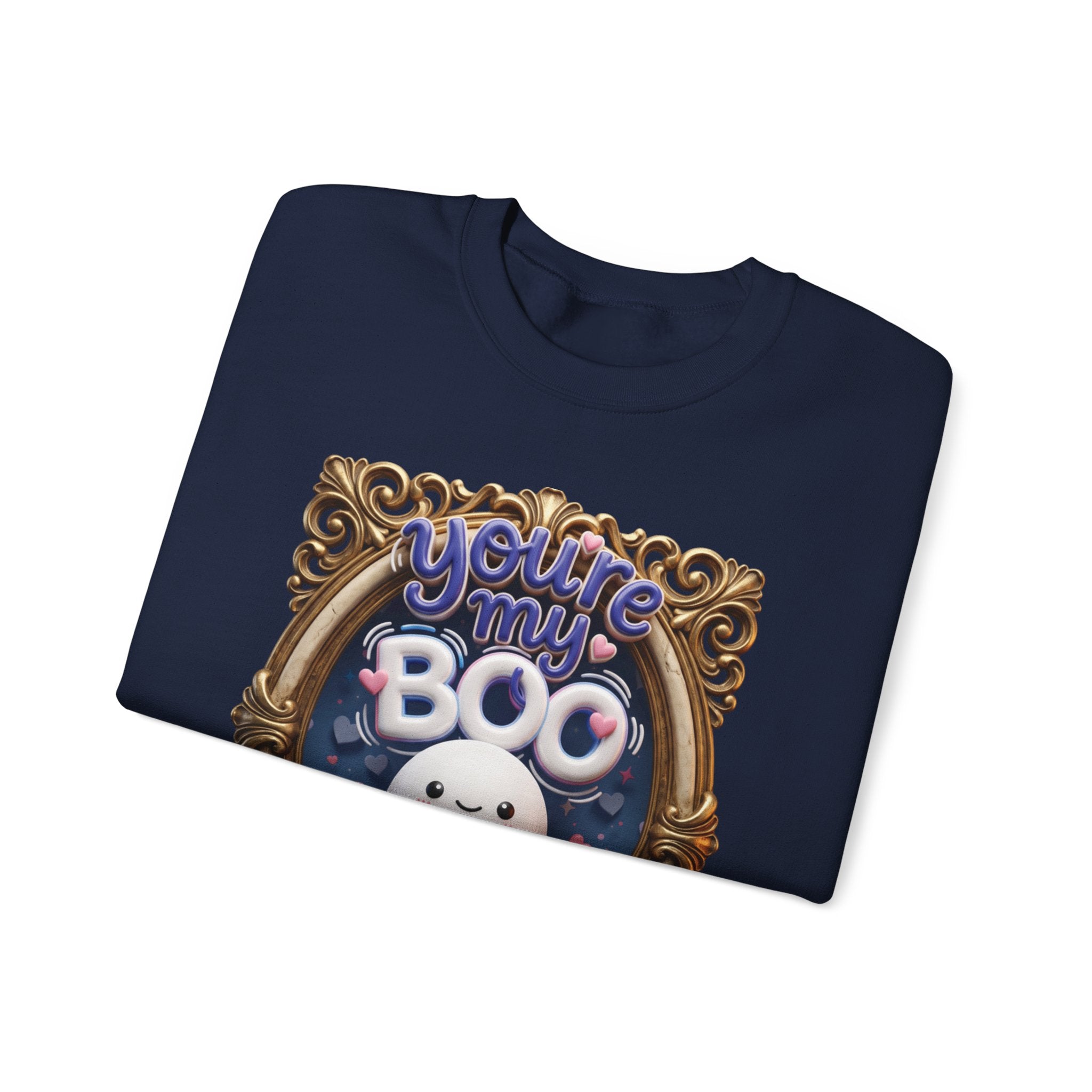 Navy crewneck sweatshirt folded to show the round smiling ghost floats inside a gilded vintage frame print