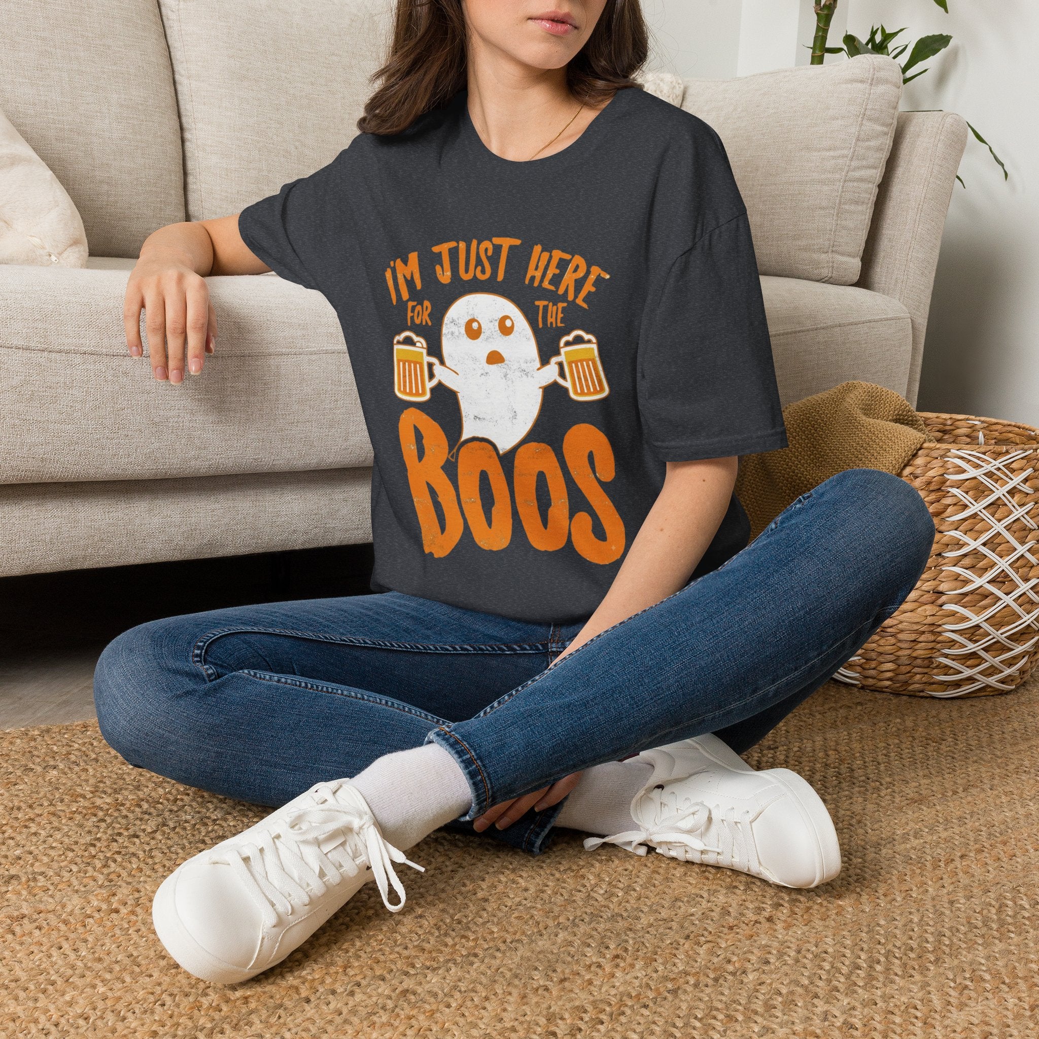 Dark Heather Grey t-shirt laid flat, printed with a single wide-eyed ghost raising a frothy pint under chunky