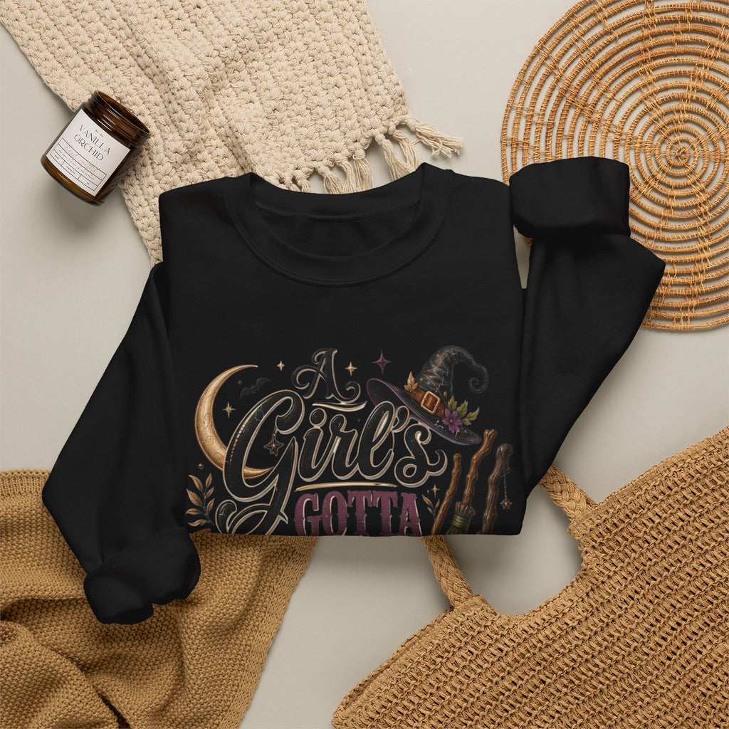 Black crewneck sweatshirt styled flat with a candle — hand-lettered A Girl's Gotta Have Options