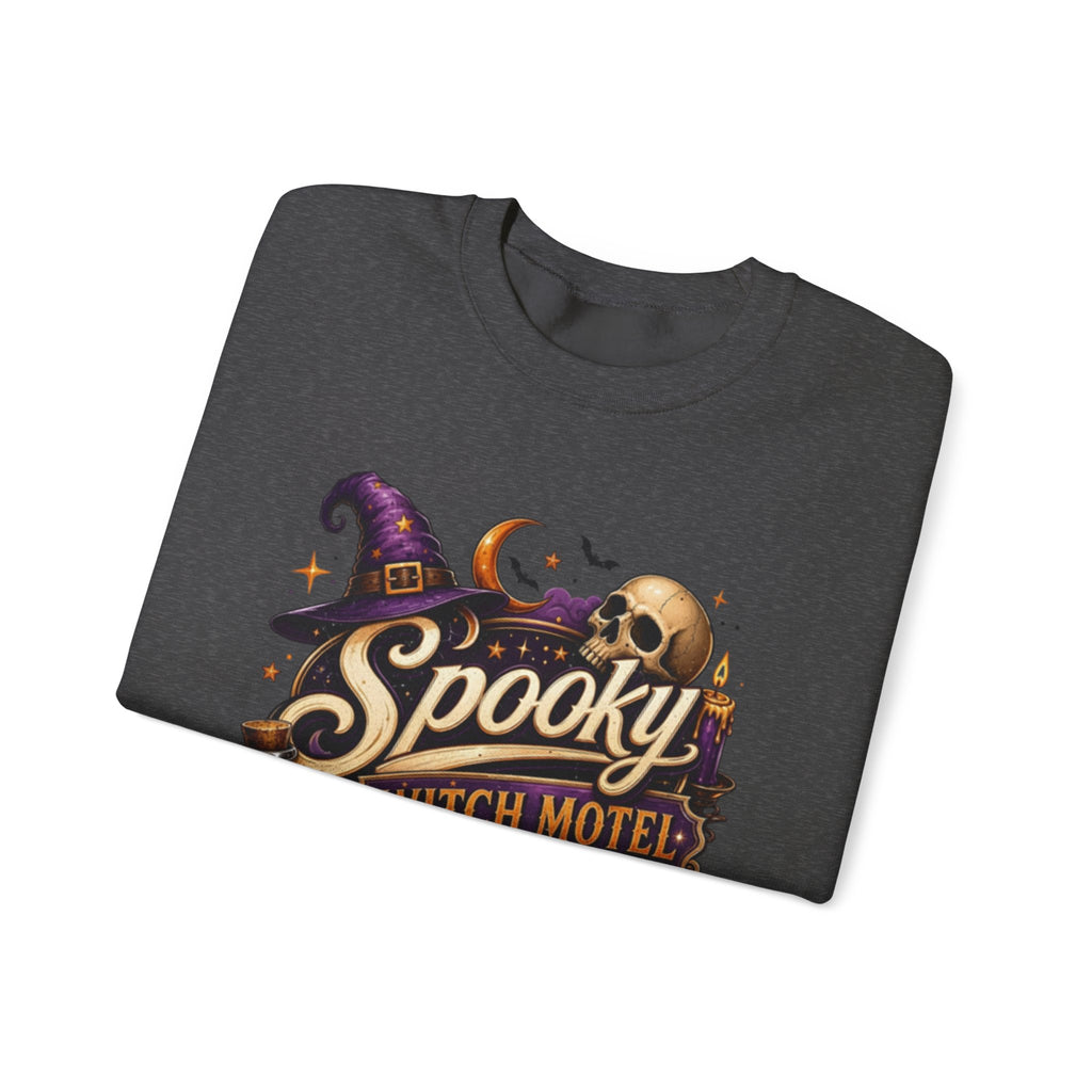 Dark Heather crewneck sweatshirt folded to show the neon vintage motel sign reading spooky witch motel print