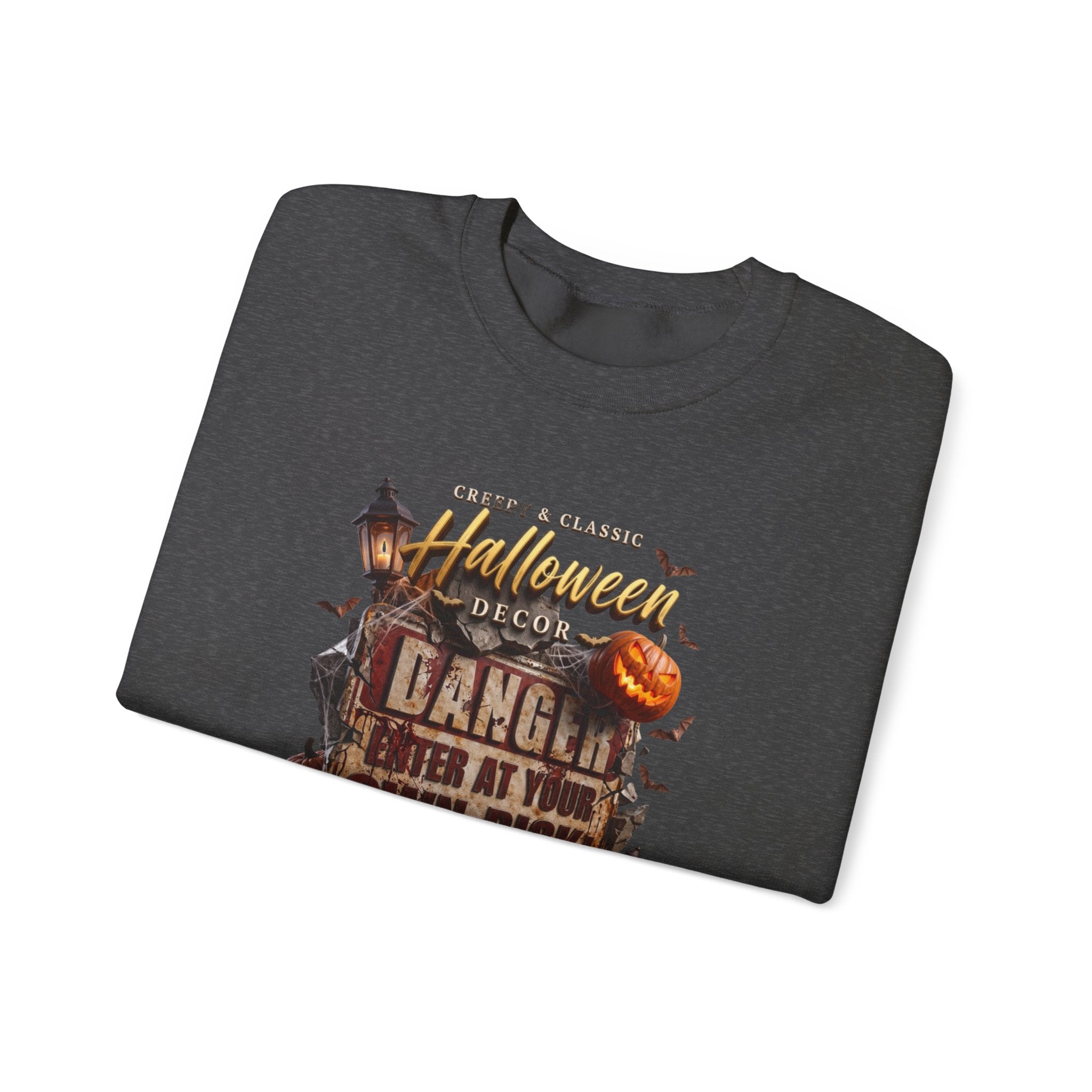 Dark Heather crewneck sweatshirt folded to show the aged danger sign hangs above a cluster of glowing print