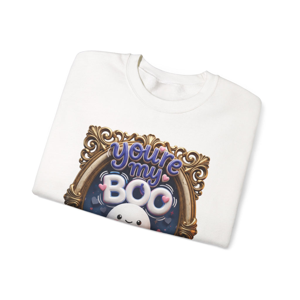 White crewneck sweatshirt folded to show the round smiling ghost floats inside a gilded vintage frame print