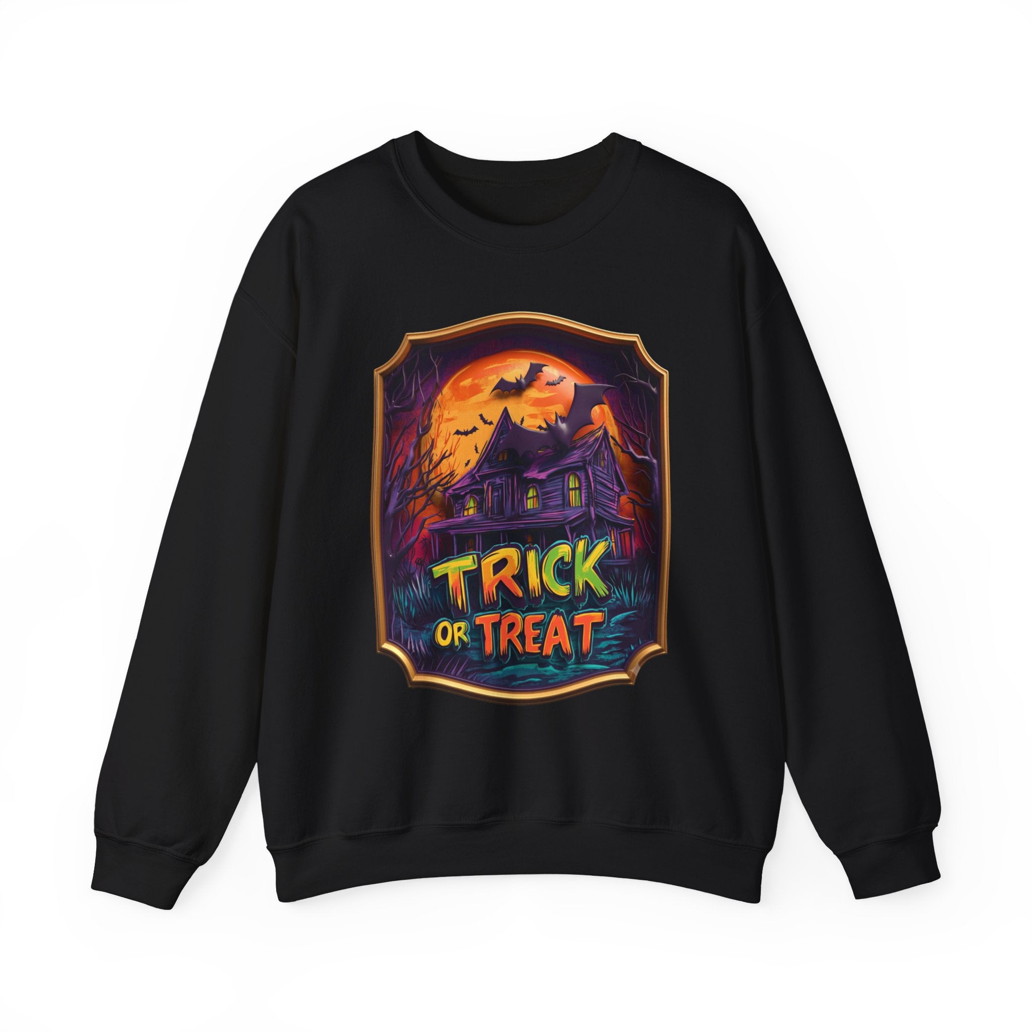 Black crewneck sweatshirt laid flat, printed with a purple haunted mansion sits under a blazing orange moon