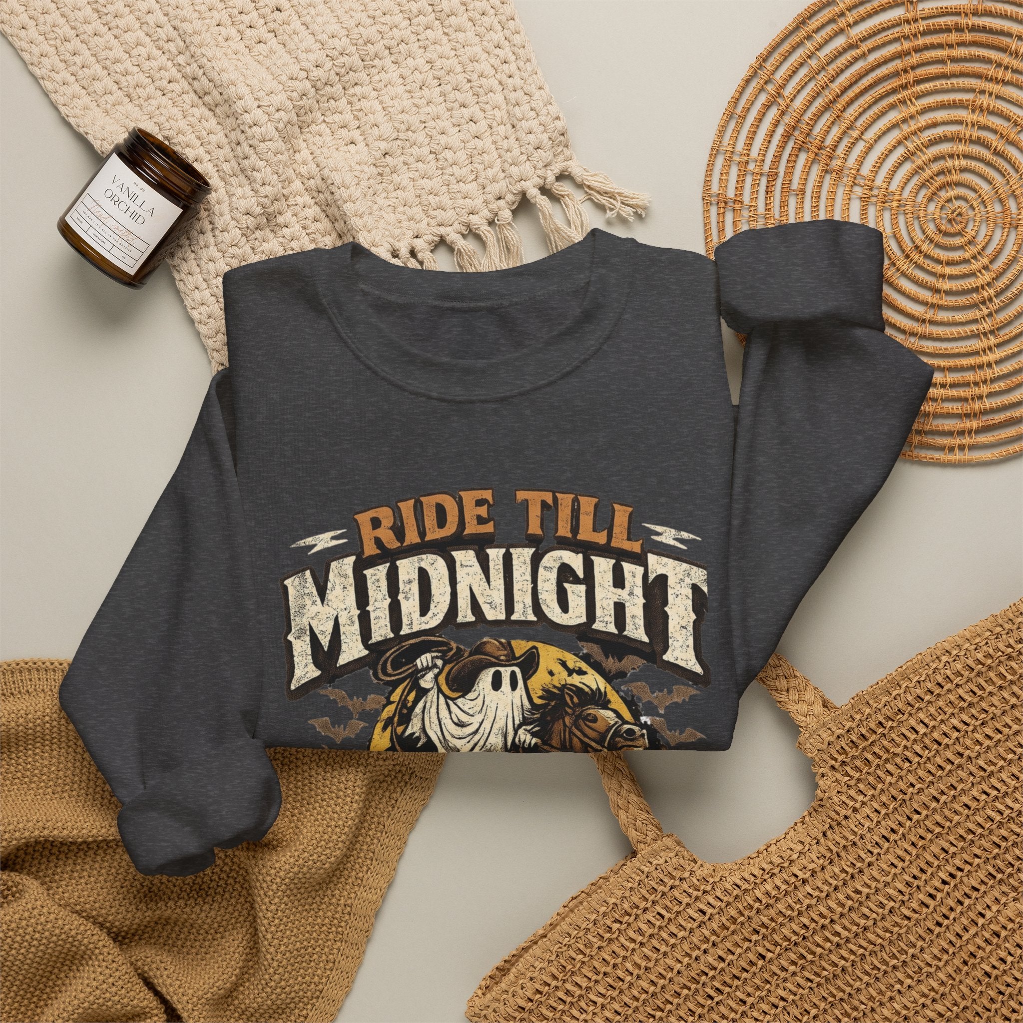 Dark Heather crewneck sweatshirt styled flat with a candle — skeleton riding a motorcycle