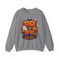 Graphite Heather crewneck sweatshirt laid flat, printed with a puffy orange trick or treat lettering frames a bow-wearing